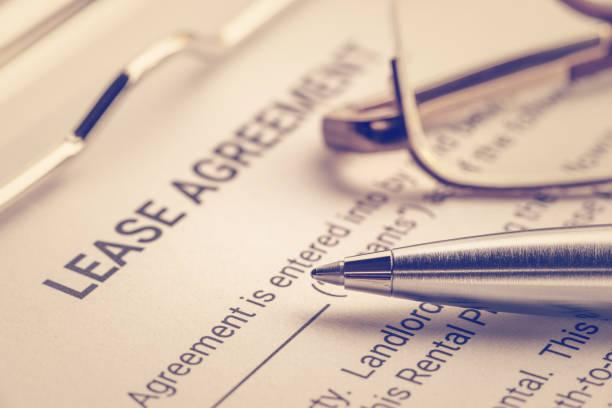 https://media.istockphoto.com/id/1025416712/photo/business-legal-document-concept-pen-and-glasses-on-a-lease-agreement-form-lease-agreement-is.jpg?b=1&s=612x612&w=0&k=20&c=h6D3-LhcJRfJnzAh4fQFyY_JeyWSOoIqI3gnFrgSC34=